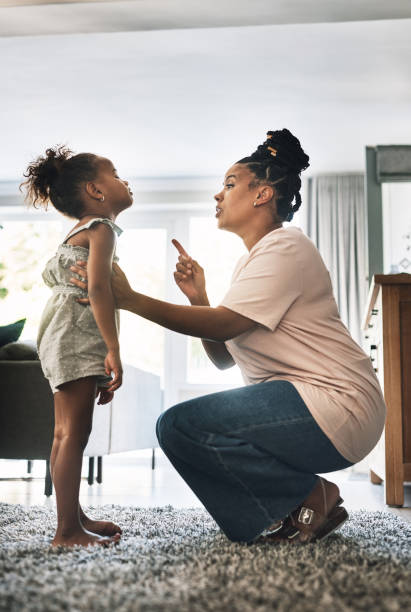 mother guiding child through behavior correction