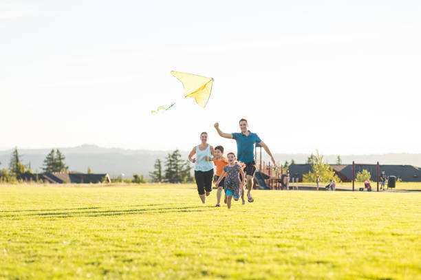 kite flying with kids in the park